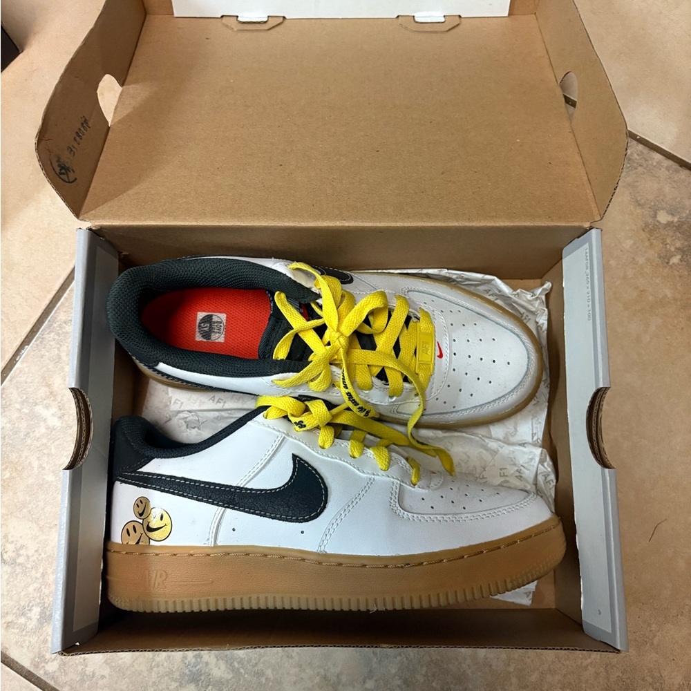 Nike White Sneakers with Yellow Laces and Black Swoosh